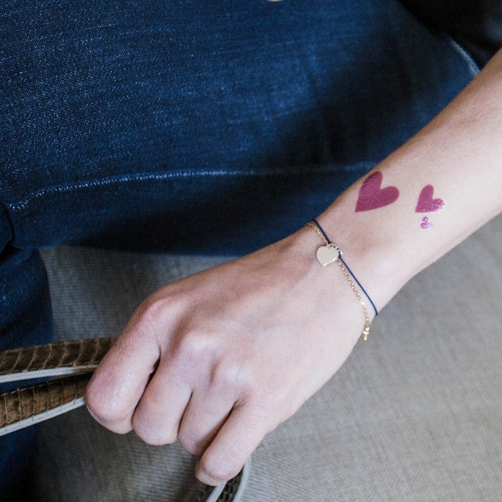 simple heart tattoo designed on wrist - Design of TattoosDesign of Tattoos